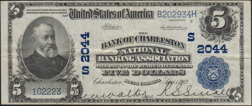 This image features an 1902 $5 South Carolina National Banknote